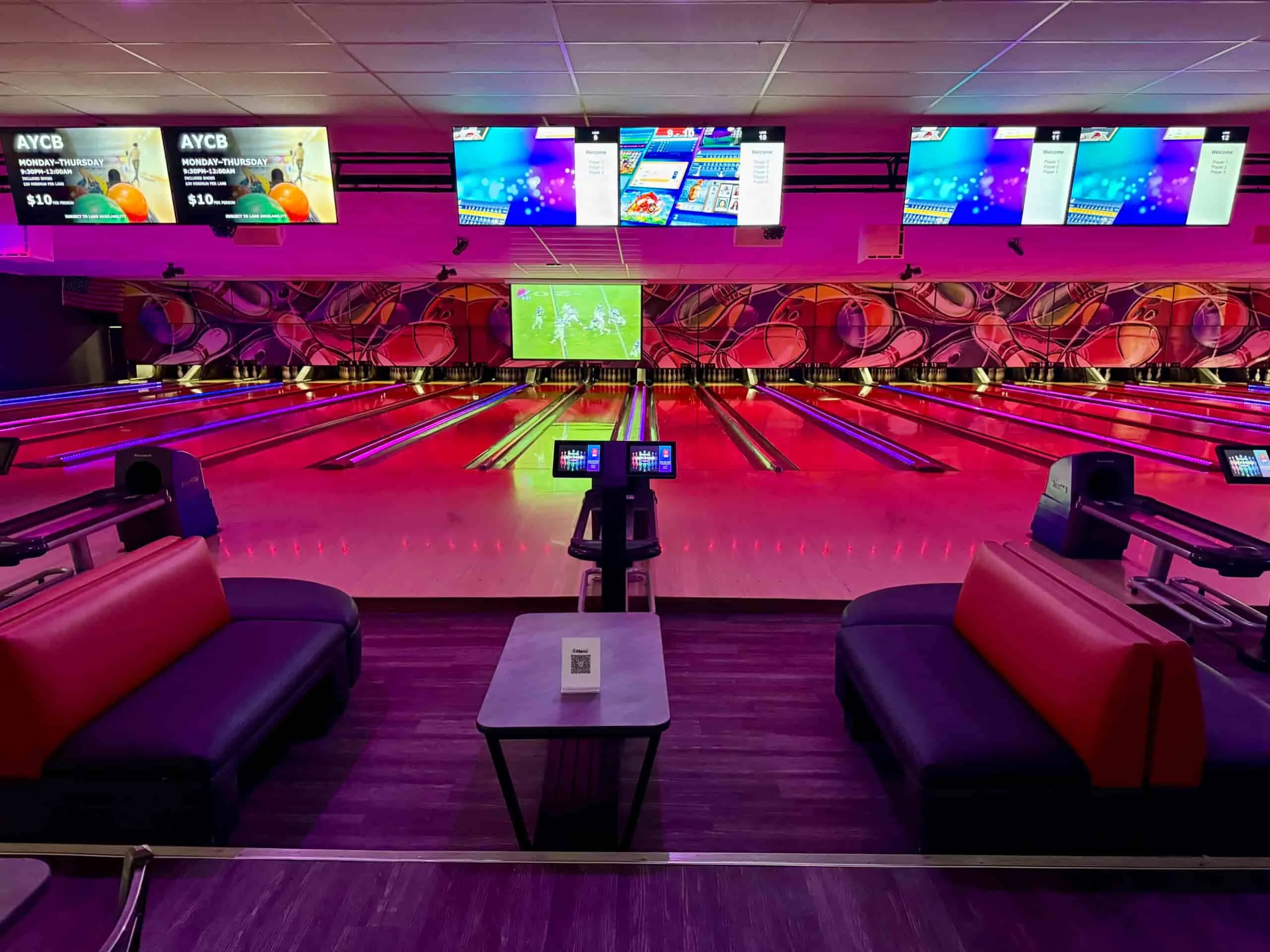 VIP Bowling Lanes at Strikers Sunrise Bowling Center VIP bowling lanes at Strikers Sunrise featuring comfortable lounge seating, interactive scoring screens, neon lighting, and modern bowling lanes in Sunrise, Florida.